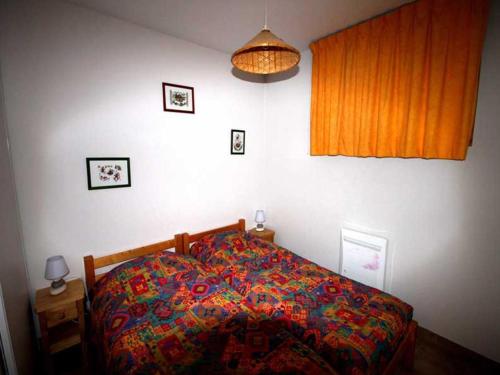 Ένα ή περισσότερα κρεβάτια σε δωμάτιο στο Appartement Avec Balcon