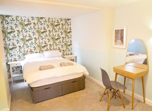 Postel nebo postele na pokoji v ubytování Garden Apartment Winchester