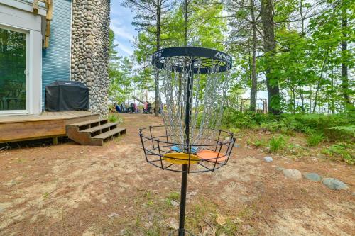 a frisbee catcher in the middle of a yard at Waterfront Cheboygan Home with Fire Pit in Cheboygan
