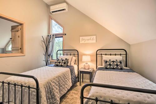 a bedroom with two beds and a window at Serene Hideaway with Views, 1 Mi to Hike and Ski! in Wintergreen