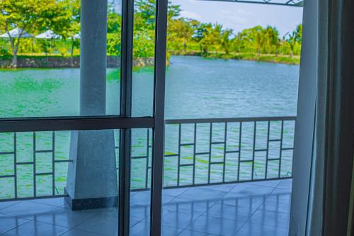 a view of a river from a window at Hotel Sanasuma in Hambantota