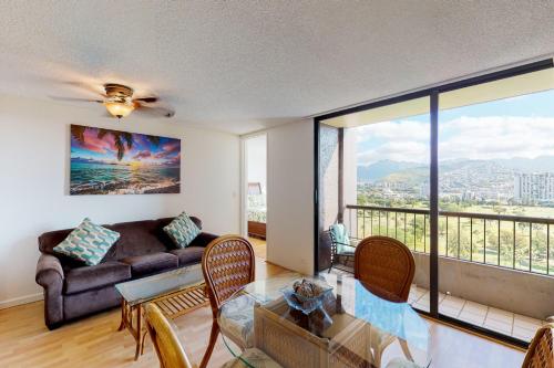 a living room with a couch and a table at Monte Vista 1704 in Honolulu