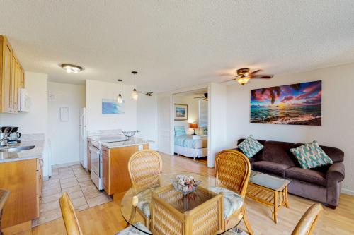 a living room and kitchen with a couch and a table at Monte Vista 1704 in Honolulu
