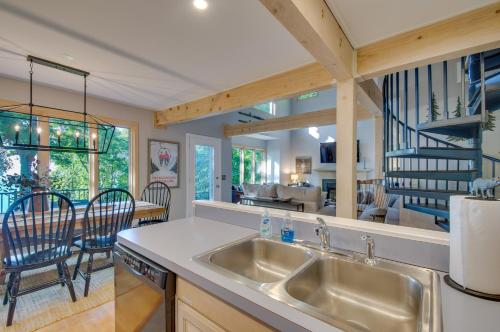 a kitchen with a sink and a living room at Serene Hideaway with Views, 1 Mi to Hike and Ski! in Wintergreen