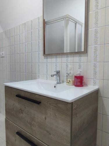 a bathroom with a sink and a mirror at Celia in Redondela