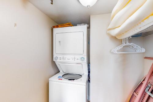 a washer and dryer in a small room at Emerald Surf 502 in Navarre