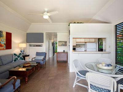 a living room with a couch and a table at Kiahuna Plantation Kauai by OUTRIGGER - Select Your Unit in Koloa