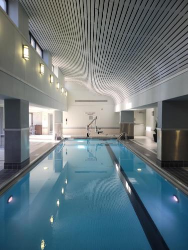 a large swimming pool in a building with a ceiling at Courtyard by Marriott Chicago Downtown/River North in Chicago