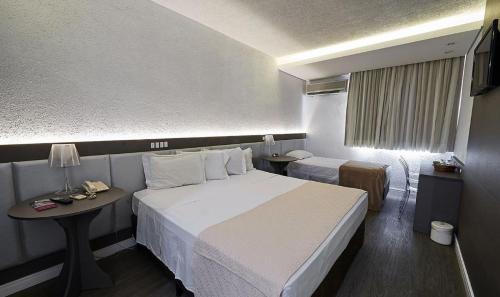 Ліжко або ліжка в номері Dall’Onder Grande Hotel Bento Gonçalves