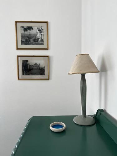 a lamp sitting on top of a pool table at Elaia House-Eλαία in Spetses