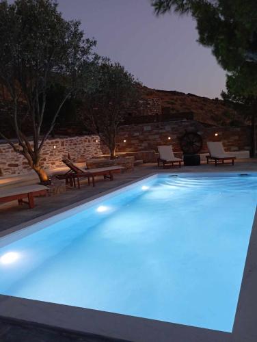 a large swimming pool with blue lights on it at Villa Art Natalie in Kithnos