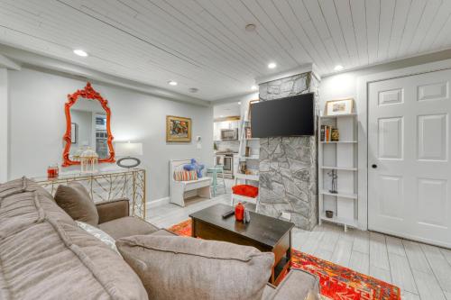 a living room with a couch and a fireplace at Pearl of Portland in Portland