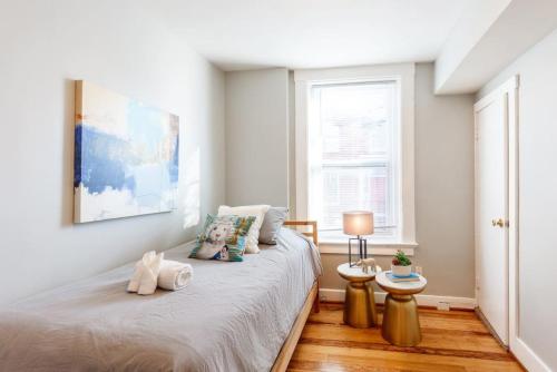 a bedroom with a bed and a window at Spacious Home Walk to Everything and FREE Parking in Cincinnati