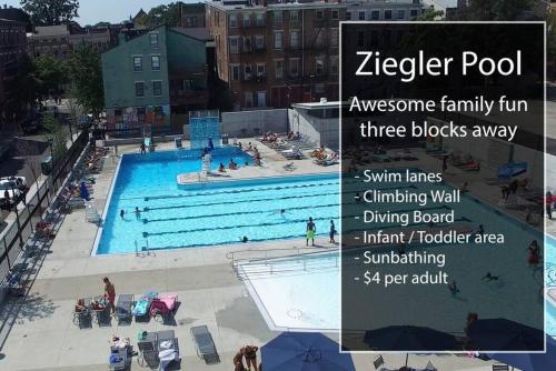 a large swimming pool with people in it at OTR Penthouse Walk Everywhere FREE Parking in Cincinnati
