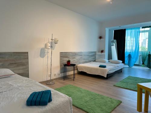 En eller flere senge i et værelse på green apartment 70