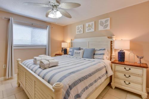 a bedroom with a bed and a ceiling fan at Beach and Pool Access Hilton Head Resort Condo in Hilton Head Island
