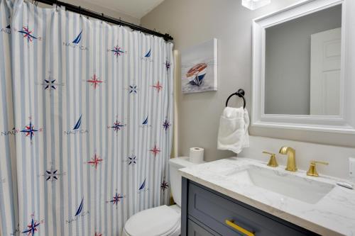 a bathroom with a shower curtain with stars at Beach and Pool Access Hilton Head Resort Condo in Hilton Head Island