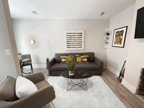 a living room with a couch and a table at Quiet 1-Bedroom Loft near Entertainment District in Cincinnati
