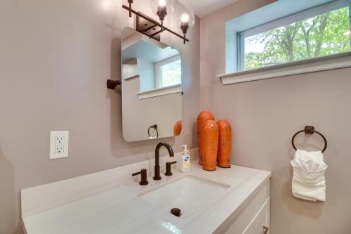 a bathroom with a sink and a mirror at Charming Retreat in Charlottesville with Deck! in Charlottesville