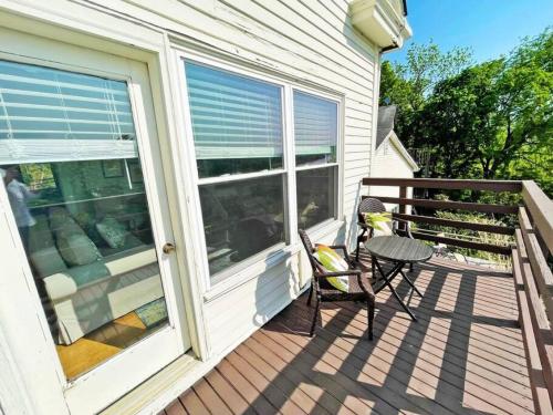 a porch with a chair and a table on a house at Lovely 2bd in Mount Adams near Downtown and OTR in Cincinnati