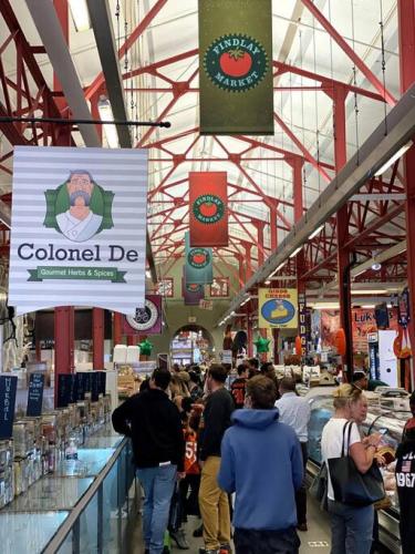 a group of people walking through a grocery store at WALK TO ALL in Over The Rhine Cincinnati in Cincinnati
