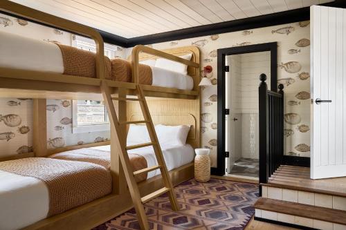 a bunk bed room with two bunk beds in a house at Faraway Martha's Vineyard in Edgartown