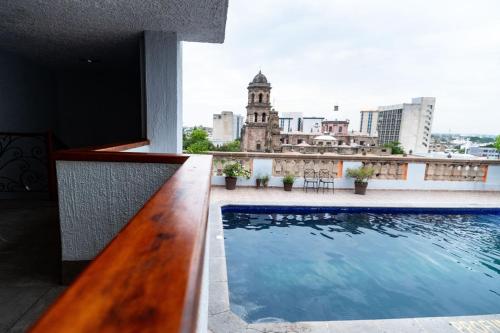 a view from the balcony of a building with a swimming pool at Hotel Santiago De Compostela - Guadalajara Centro Historico in Guadalajara