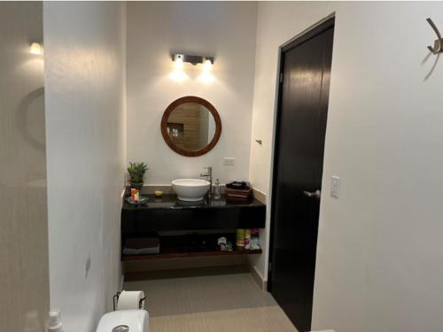 a bathroom with a sink and a mirror at Casa Amor! Completely Private Home & Pool, Close Beach, Bikes in Loreto