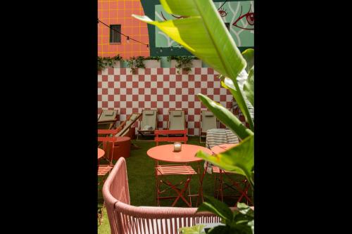 a patio with a table and chairs and a table at Upon Angels - Adults Only in Lisbon