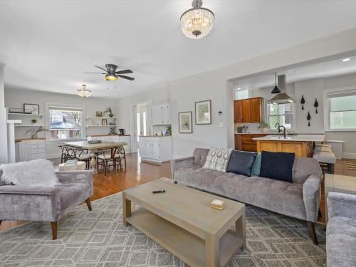 a living room with a couch and a table at Deluxe 6 Bedroom 3 Min to Downtown w 2-car Driveway in Cincinnati