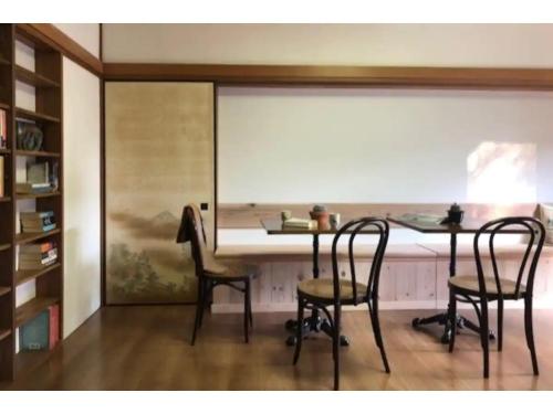 a dining room with two chairs and a table at Masaya Villa - Vacation STAY 23215v in Ito