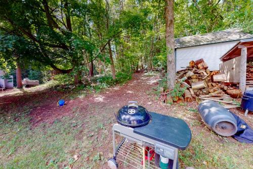 a grill with a pot on top of it in a yard at Garden Island's Maple in Charlotte