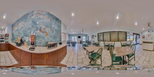 a large room with a large rock in the middle of it at Econo Lodge Inn & Suites Fulton - Rockport in Rockport