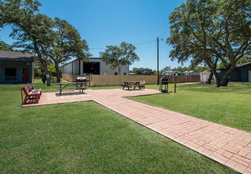 a park with two benches and a picnic table at Econo Lodge Inn & Suites Fulton - Rockport in Rockport