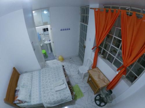 Tempat tidur dalam kamar di Nanasqa Hostel en Nasca / Nazca