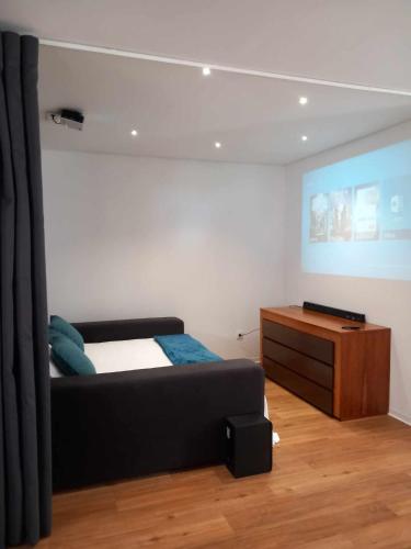a bedroom with a bed and a dresser in it at Casa de Silvares in Celorico de Basto