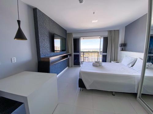 Ένα ή περισσότερα κρεβάτια σε δωμάτιο στο Flat Particular Vision com Vista Panorâmica Central - 15º andar