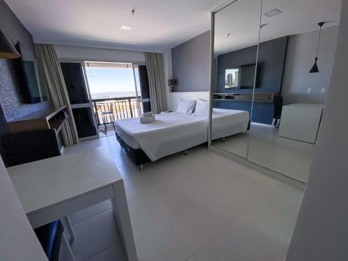 Ένα ή περισσότερα κρεβάτια σε δωμάτιο στο Flat Particular Vision com Vista Panorâmica Central - 15º andar