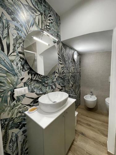 a bathroom with a sink and a mirror at Dimora Nonno Ciccio in Polignano a Mare