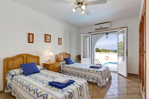 Posteľ alebo postele v izbe v ubytovaní Villa Claudia by Villa Plus