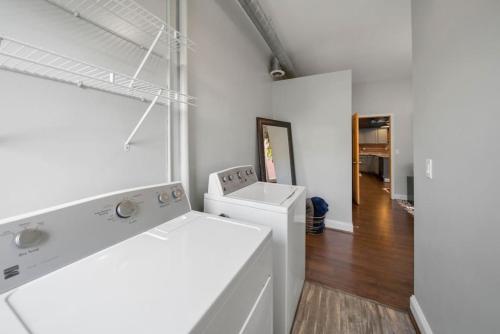 a white laundry room with a washer and dryer at City Escape 2BR Steps to TQL near OTR and Downtown in Cincinnati
