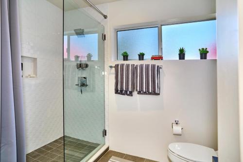 a bathroom with a shower and a toilet at Sophia Oasis Luxe 2BR Condo with Mountain Views in Palm Springs