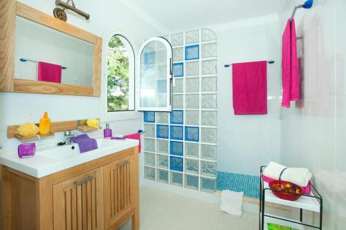 a bathroom with a sink and a mirror at Villa Reco by Villa Plus in Felanitx