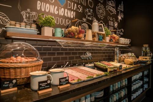a bakery with a buffet of food on a counter at Motel One Hannover-Oper in Hannover