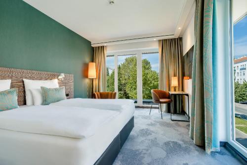 Posteľ alebo postele v izbe v ubytovaní Motel One Wien-Prater