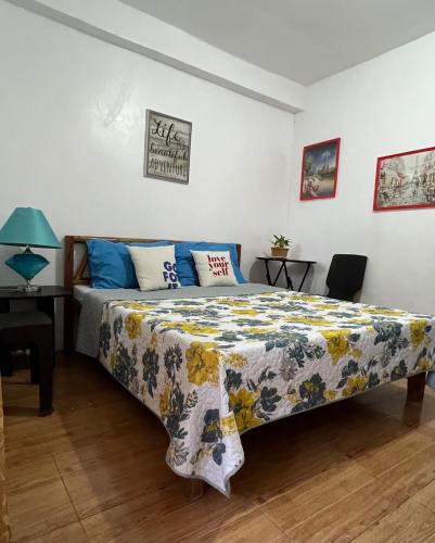 a bedroom with a bed and a desk at Treasure Beach Resort in Carles