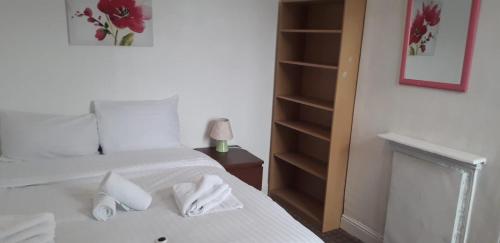 Postel nebo postele na pokoji v ubytování New Find Guest House M22