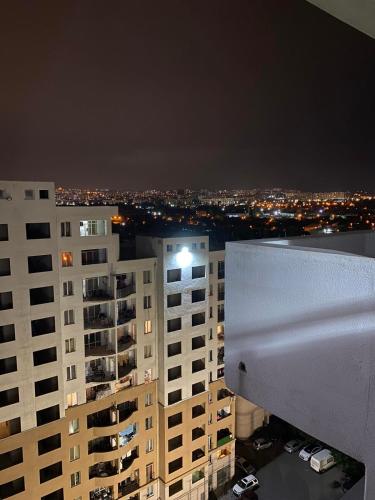 a view of a city at night with buildings at Tbilisi cozy apartment in Tbilisi City