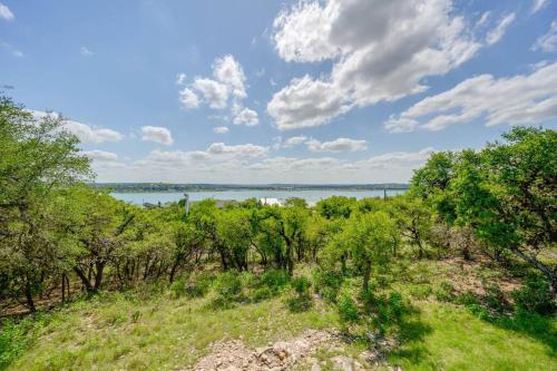 a view of the water from a hill with trees at Sunset Ridge 2King Beds Lake Hot Tub Pool in Canyon Lake