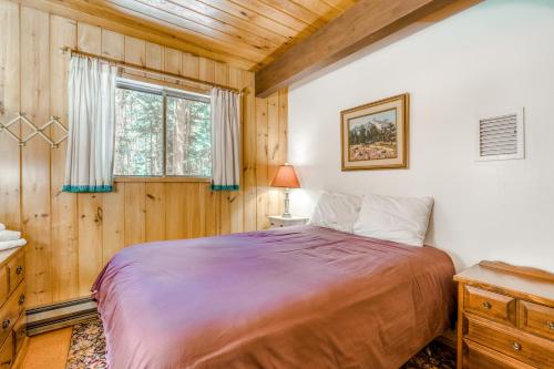 a bedroom with a large bed and a window at Ski Haus in Government Camp